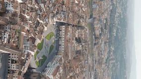 Vertical video. Florence, Italy. Basilica di Santa Maria Novella. Piazza di Santa Maria Novella. Summer. Evening, Aerial View, Departure of the camera - Powered by Shutterstock - Get 15% off with code: PIKWIZARD15
