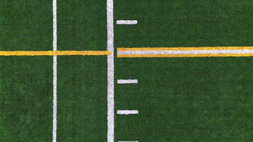 Pan Down and Rocket View of Turf Football Field from the Fifty Yard Line Royalty-Free Stock Footage #3487400187