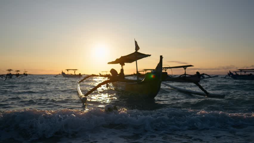 Asian longtail boats in ocean at sunset. Touristic vintage traditional Thailand boats on sea shore on Landscape nature background. Travel outdoor, tourism sight, adventure, landscape concept.