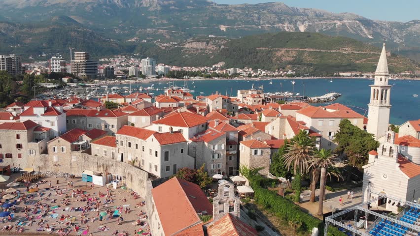 Aerial view of Budva, old and modern city on Adriatic Sea coast. Center of Montenegrin tourism and popular sea resort.