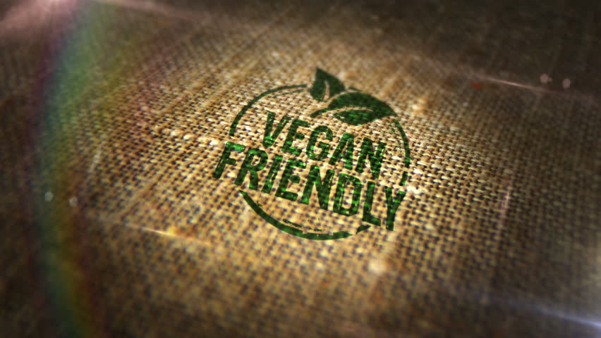 Vegan friendly sign stamp on natural linen sack. Vegetarian organic food 3D design abstract concept. Looped and seamless animation.