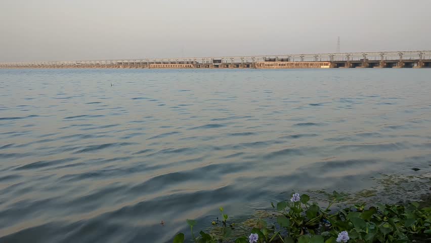 Ganga River Flowing against a background of Farakka Barrage.
Farakka Barrage Over river Ganga is about 2,304 metres (7,559 ft) long. Royalty-Free Stock Footage #3487538579