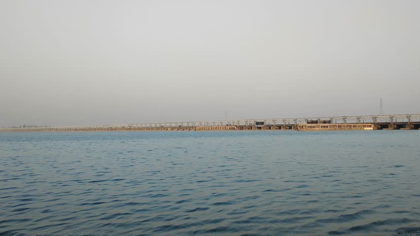 Ganga River Flowing against a background of Farakka Barrage.
Farakka Barrage Over river Ganga is about 2,304 metres (7,559 ft) long. Royalty-Free Stock Footage #3487540795