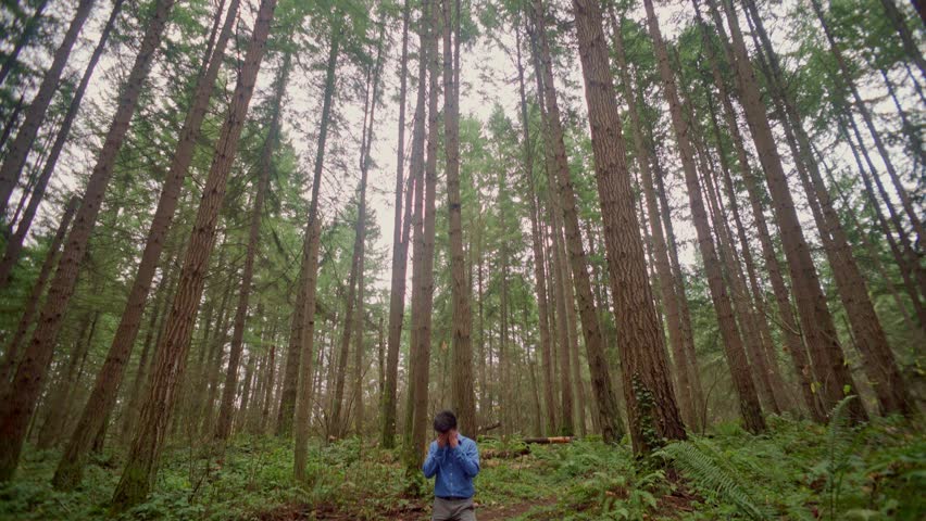angry asian man lost in woods