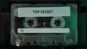 Playing Cassette Tape With Top Secret Audio Recording, Close Up - Powered by Shutterstock - Get 15% off with code: PIKWIZARD15