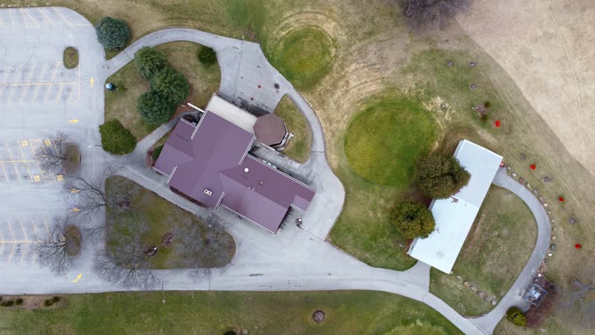 aerial flyover of a large parking lot with trees and landscaping (Wisconsin)