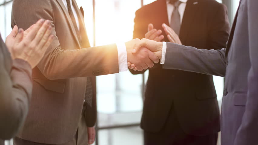 Businessman making handshake with his partner in office business etiquette, Royalty-Free Stock Footage #3487954813
