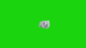 Broken chunk of clear cold ice cube spinning on chromakey green screen background. Video element for restaurant, bar, beverage advertising concept.