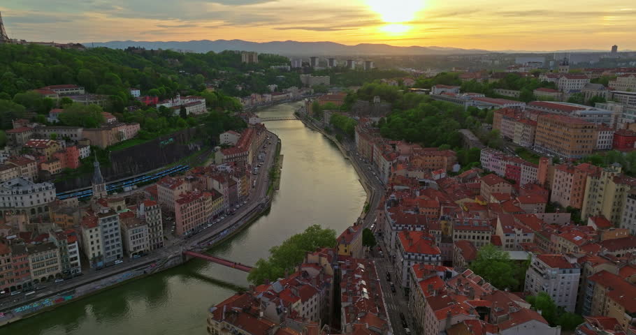Lyon historical city center with streets aerial drone video footage. Warm summer evening. Sunlight Lyon aerial Lyon France. Famous tourist holiday vacation destination in France, Europe