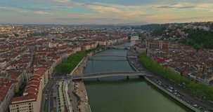 Lyon historical city center with streets aerial drone video footage. Warm summer evening. Sunlight Lyon aerial Lyon France. Famous tourist holiday vacation destination in France, Europe