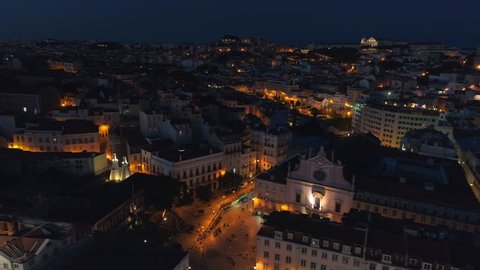 Lisbon Portugal night cityscape city centre view aerial panorama 4k drone Rossio square 