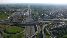 Aerial view of Peshawar Mor interchange in Islamabad Capital of Pakistan busy traffic roads and bridges.