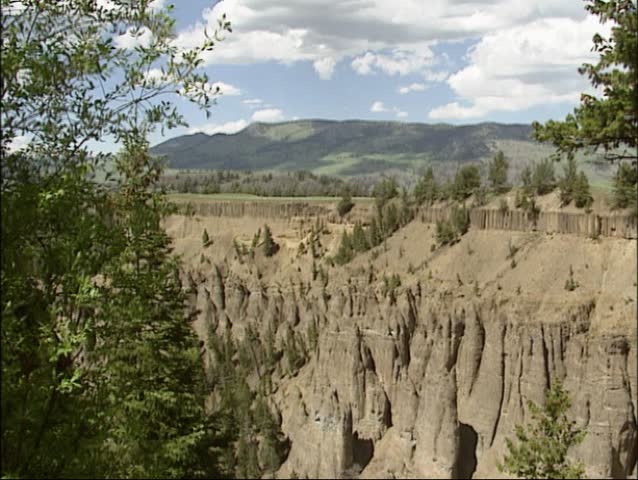Pan Pale slope of Calcite Spring with basalt rocks in Yellowstone National Park.