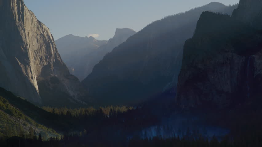 Scenic valley with mountains trees and mist in Yosemite National Park in California. El Capitan and Bridalveil Fall in the background. This video Loops seamlessly. USA