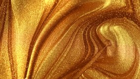 Beautiful abstract golden liquid paint background, beauty gold backdrop texture. Metallic gold paint, art design. Yellow shimmering surface close-up. Golden bright glitter texture, macro shot - Powered by Shutterstock - Get 15% off with code: PIKWIZARD15