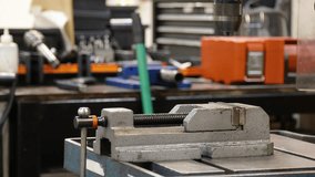 handy drill press on workshop factory table while a technician precision mechanical engineer drilling the hole - Powered by Shutterstock - Get 15% off with code: PIKWIZARD15