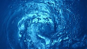 Super Slow Motion of Water Whirl in Detail. Filmed on High Speed Cinema Camera, 1000 fps. Texture of Water Tunnel, Shot from Above. - Powered by Shutterstock - Get 15% off with code: PIKWIZARD15