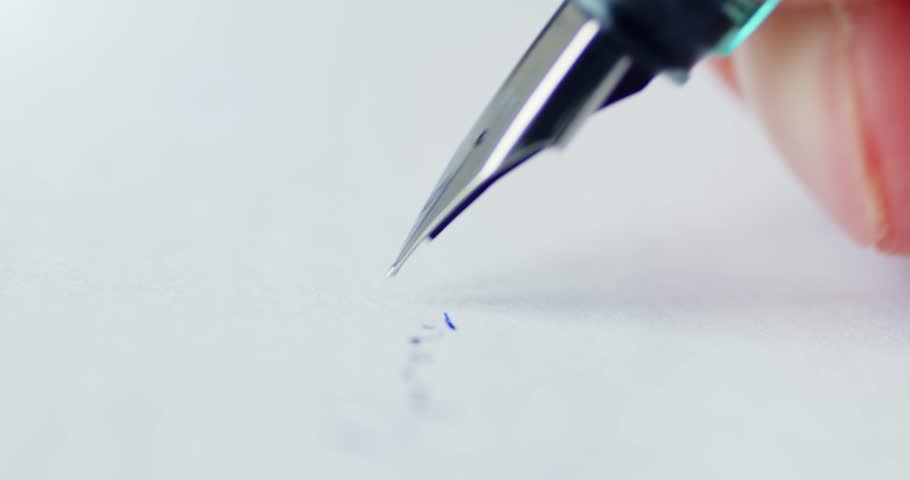 Fountain pen leaves a signature on a white paper Royalty-Free Stock Footage #3488423651