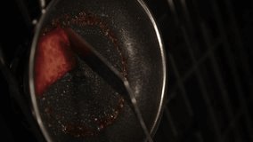 Cooking SPAM Meat in Stainless Steel Pan, Close-up Vertical