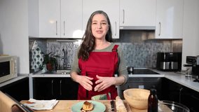 A senior vlogger records traditional cooking recipe tutorials in her kitchen