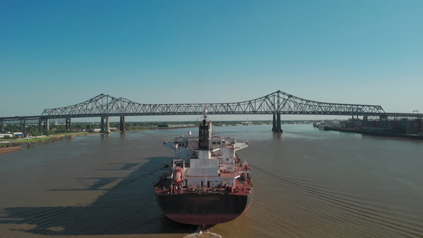 Aerial shot of Mississippi River waterfront and bridge in New Orleans, Louisiana