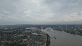 Aerial video footage of a massive cruise ship on Thames River.