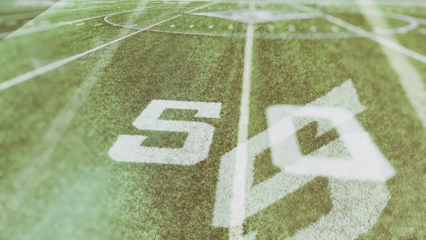 Pan of fifty yard line of football field  Royalty-Free Stock Footage #3488758447