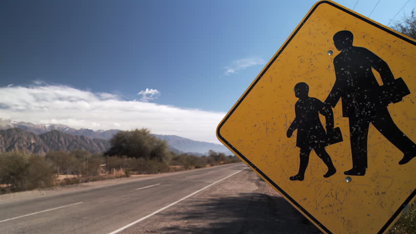 School Sign in a Countryside Road in Argentina. Close Up. 4K Resolution.