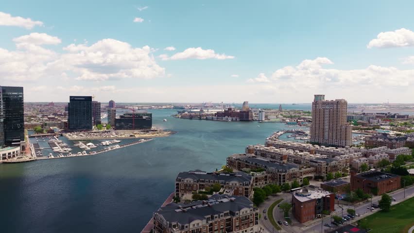 City of Baltimore, Maryland, USA, on a bright and sunny day in the inner harbor in 2024. In the distance we can see the collapsed FSK bridge.