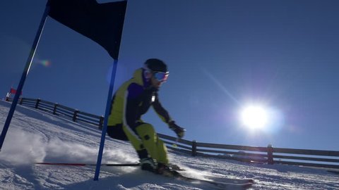 Slow motion - Slalom skier skiing past the gate