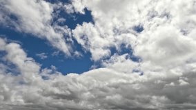 Cumulus clouds moving across a blue sky - Powered by Shutterstock - Get 15% off with code: PIKWIZARD15