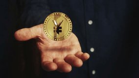 Yen Yuan cryptocurrency rotating 3d coin hovers over the businessman's hand. Business and technology seamless and looped abstract concept. - Powered by Shutterstock - Get 15% off with code: PIKWIZARD15