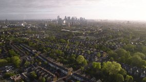 Aerial View Shot of London Suburbs, UK, Canary Wharf, rows of British homes, typical neighborhoods, real estate, Victorian architecture, and traditional houses