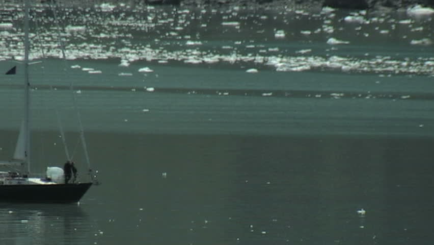 People on a sailboat getting a closer look at the Margerie Glacier in Glacier Bay, Alaska