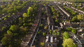 Aerial View Shot of Suburban London, UK, multiple rows of homes, victorian homes, green area, residential area, Deptford, Peckham