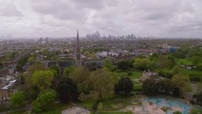 Aerial View Shot of London UK, United Kingdom, North London, London Skyline in the far backgroung, Suburbs
