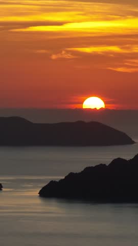 Scenic view of Sunset over the Islands and sea. El Nido, Palawan, Philippines. Vertical view.