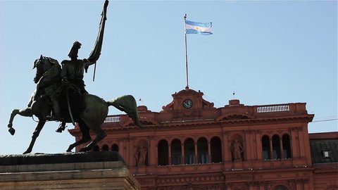 The Casa Rosada (Pink House) Presidential Palace and the Bronze Statue to General Manuel Belgrano in Plaza de Mayo (May Square), Buenos Aires, Argentina.