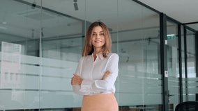 Happy 45 years old Latin professional middle aged business woman corporate leader, smiling mature female executive manager standing in office looking at camera arms crossed, portrait. - Powered by Shutterstock - Get 15% off with code: PIKWIZARD15