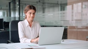 Busy mature middle aged professional business woman manager executive looking at laptop working on computer in office thinking of digital market plan or considering new corporate idea sitting at desk. - Powered by Shutterstock - Get 15% off with code: PIKWIZARD15