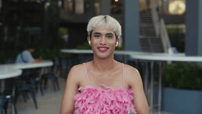 Young LGBT Journalist Doing an Interview Online, Looking into the Camera and Waving. Handsome Transgender Guy Blogger Welcomes Followers. LGBT and Technology Concept