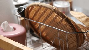 Dishwashing basket in kitchen blur background