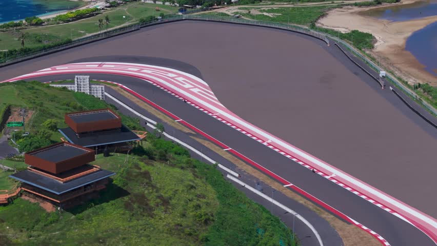 racer rides race track motorcycle