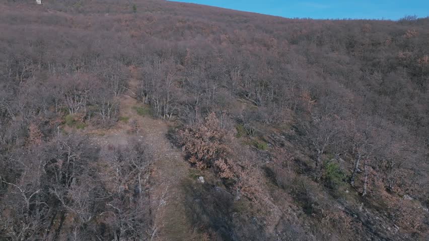 Immerse yourself in a divine perspective of the Chapel of Done in Montbrun les Bains, France, through this stunning aerial video.