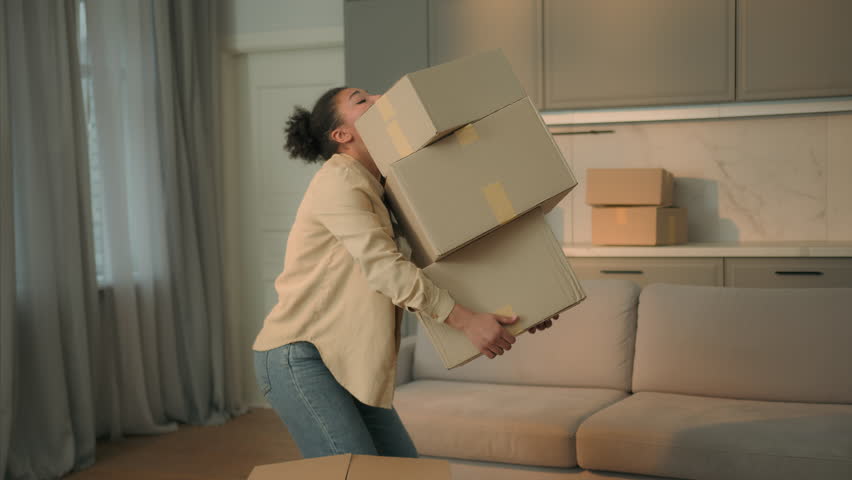 African american woman renter home owner moving in new house relocation day female courier carry deliver cardboard boxes to apartment tired girl drop parcels upset displeased failure shopping delivery