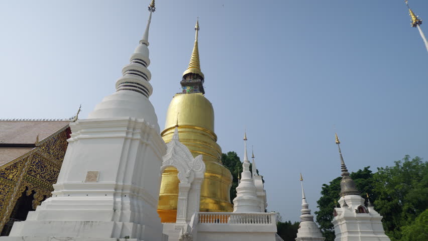 Dolly shot of golden pagoda at Suandok temple Chiangmai thailand steady cam 