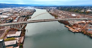 Flight above the Willamette River in Portland, Oregon, the USA. Cars move in one direction by the Fremont Bridge.