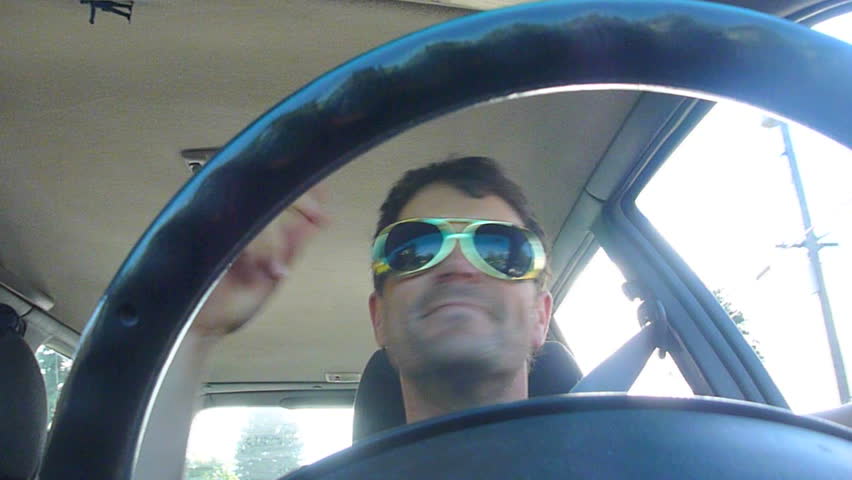 Funny clip series of model released man driving car, dancing and listening to