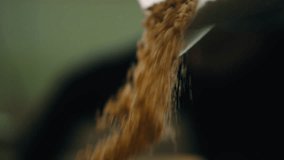 A Person pouring crushed cookies - Powered by Shutterstock - Get 15% off with code: PIKWIZARD15