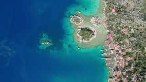 antalya kekova kalekoy castle aerial drone video turquoise blue sea cloudy sky settlement port and peninsula